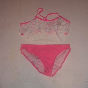 A neon pink and water colored bikini